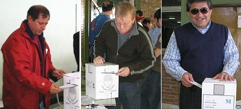 Tres de los candidatos a intendente, en el momento de sufragar.