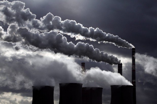 Cooling towers and smoke stacks are seen at the coal powered Pocerady power station near Louny